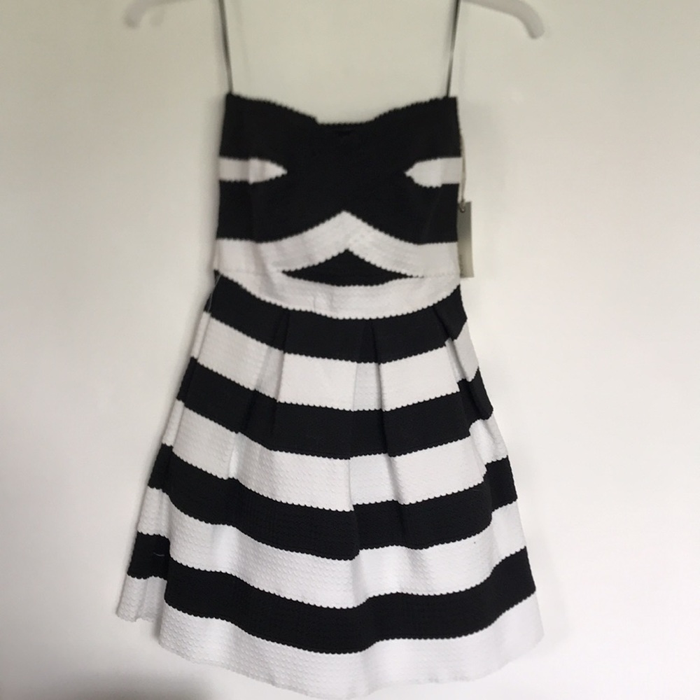 Brand NEW- Cocktail dress Size small. HAVE